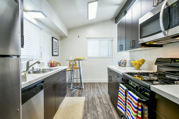 Sleek kitchen with stainless steel appliances at Arbors at Antelope Apartments