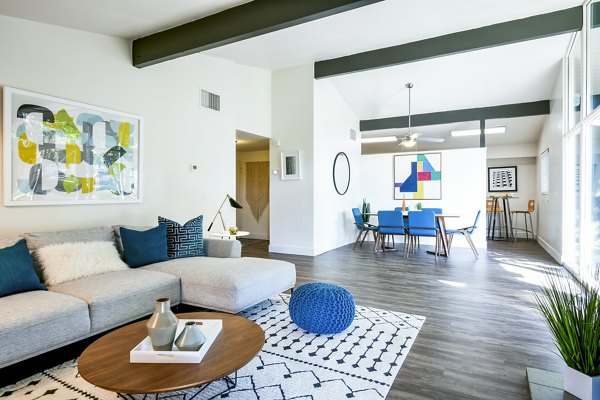 Spacious living room with modern decor in Arbors at Antelope Apartments