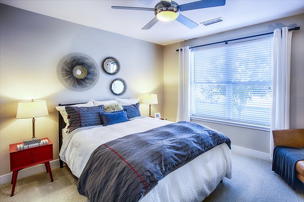 Elegant bedroom with modern furnishings at RockVue Apartments in Broomfield