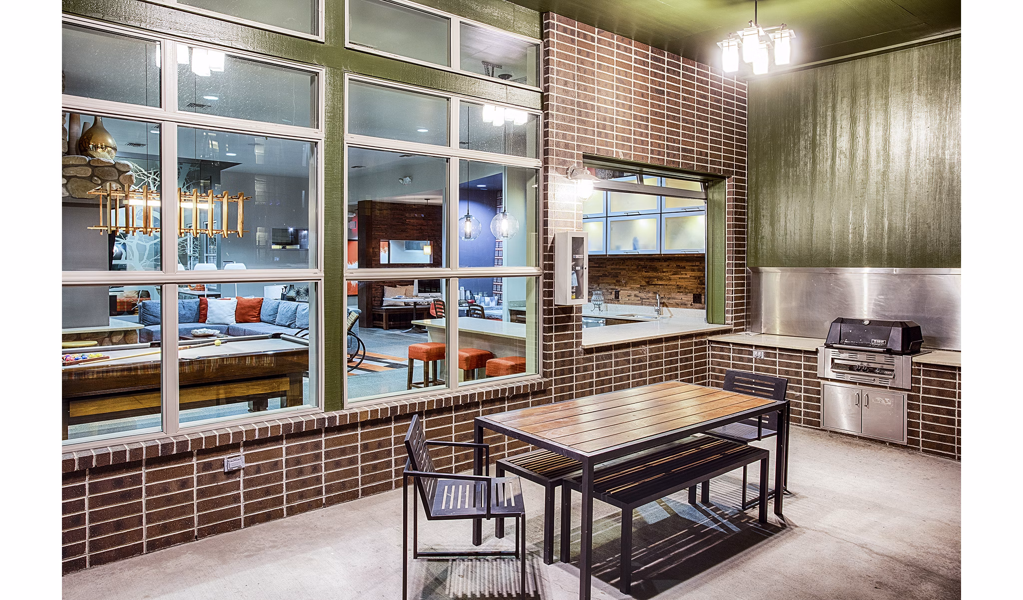 Grill area with outdoor seating at RockVue Apartments in luxury Greystar community