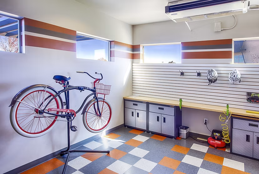 RockVue Apartments: Dedicated bike maintenance area with tools and stands for resident cyclists