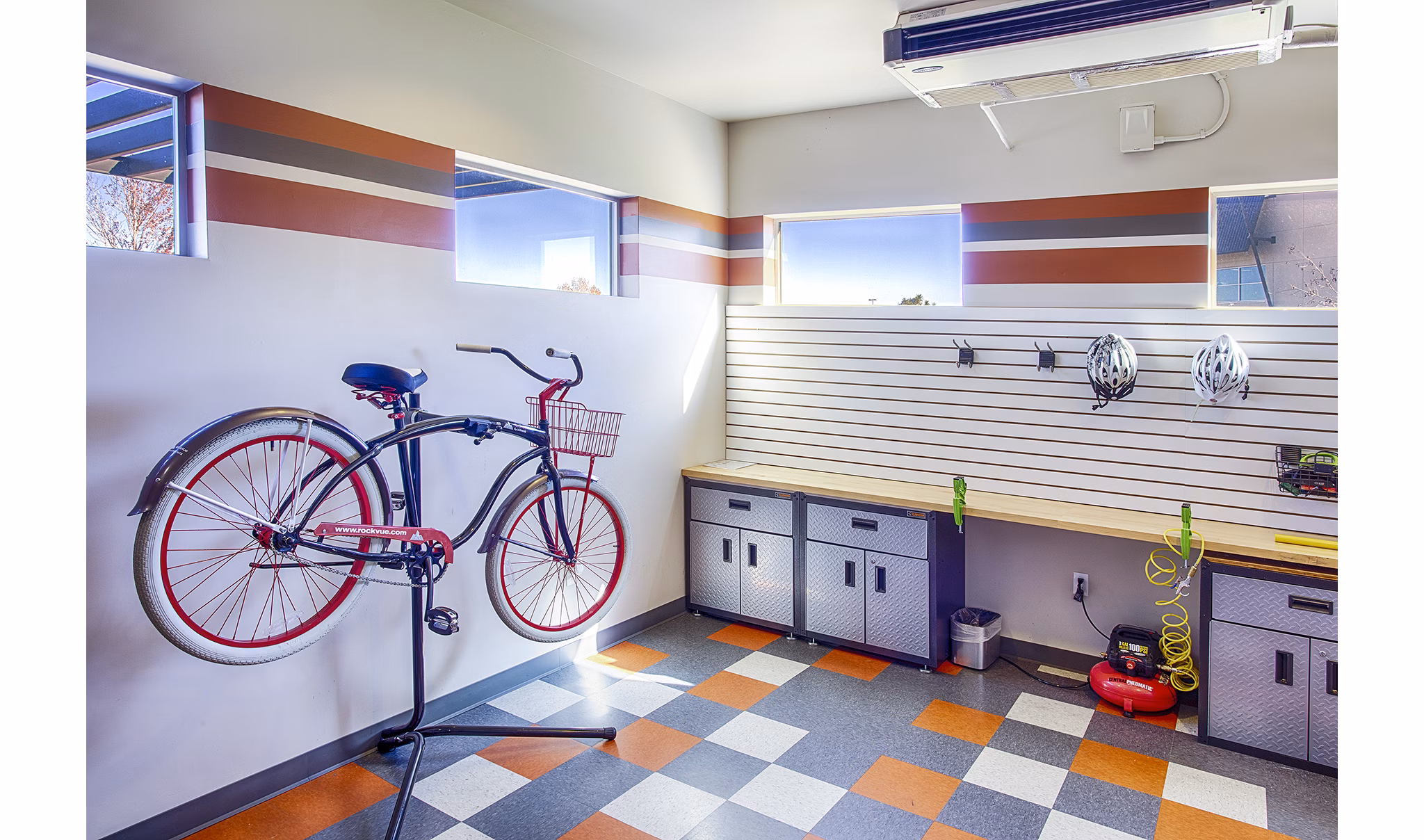 RockVue Apartments: Dedicated bike maintenance area with tools and stands for resident cyclists