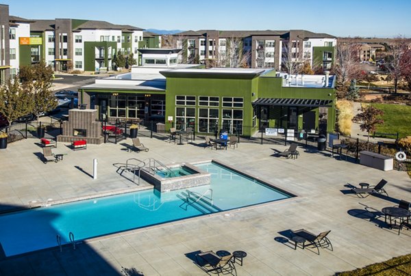 Modern poolside lounging area at RockVue Apartments, a Greystar community in Broomfield, offering luxury amenities for relaxation and recreation