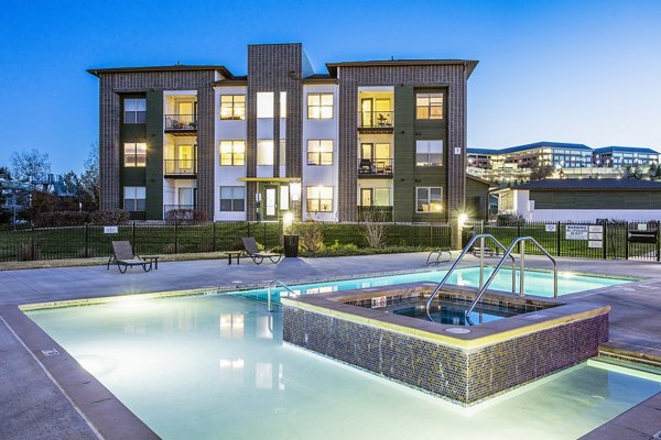 Inviting hot tub area at RockVue Apartments, perfect for relaxation and leisure activities in a luxurious setting