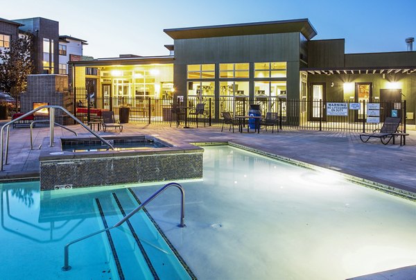 Luxurious hot tub and pool area at RockVue Apartments offering relaxation and leisure amenities for residents
