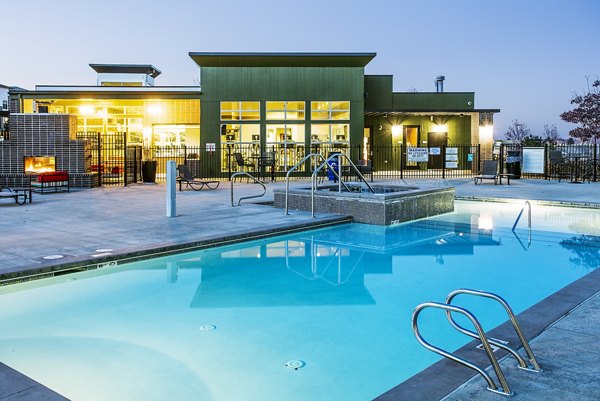 Luxurious pool area with lounge chairs at RockVue Apartments in Colorado, providing a relaxing retreat for residents