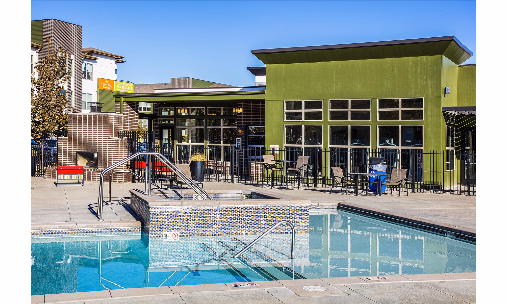 Relaxing hot tub at RockVue Apartments with mountain views, ideal for unwinding in luxury and comfort