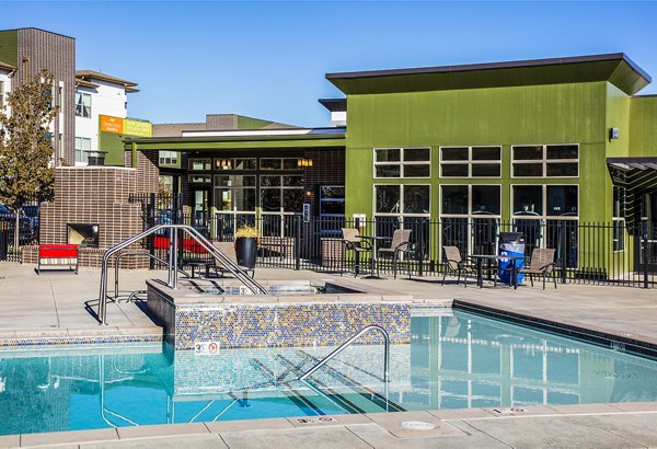 Relaxing hot tub at RockVue Apartments with mountain views, ideal for unwinding in luxury and comfort