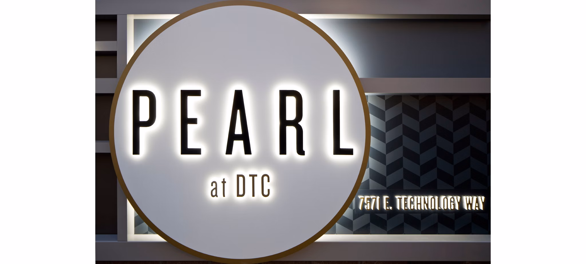 Pearl DTC Apartments: Elegant signage at luxury apartment community entrance