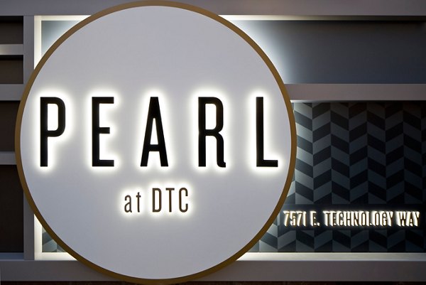 Pearl DTC Apartments: Elegant signage at luxury apartment community entrance