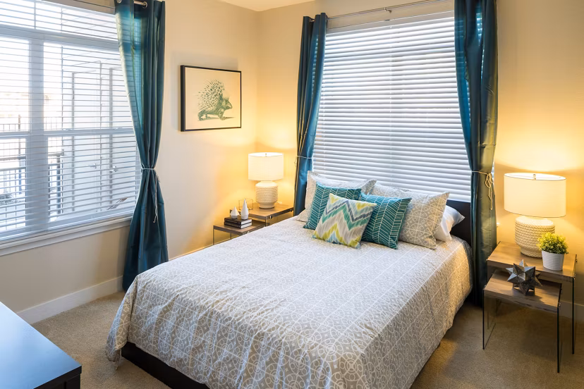 Spacious bedroom with modern furnishings in Pearl DTC Apartments