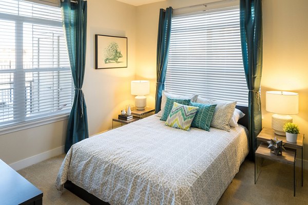 Spacious bedroom with modern furnishings in Pearl DTC Apartments