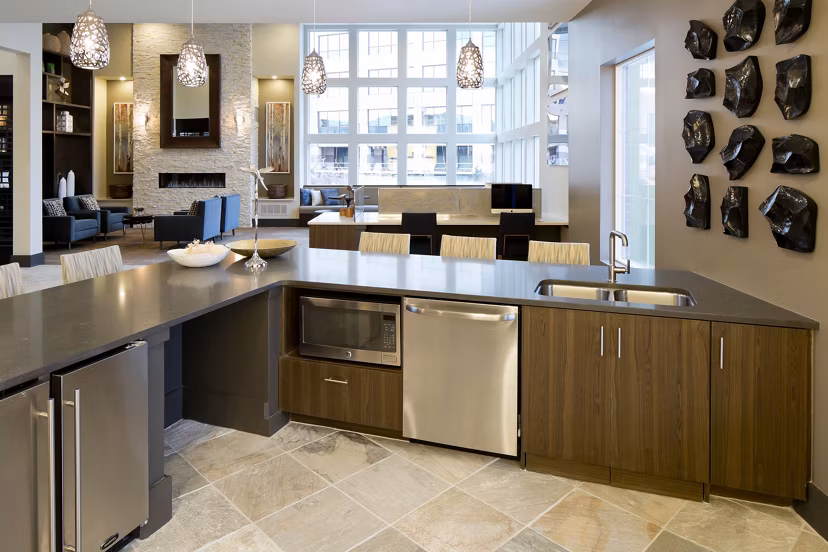 Spacious clubhouse with modern furnishings at Pearl DTC Apartments, offering a luxury social space for residents