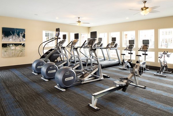State-of-the-art fitness center at Pearl DTC Apartments with modern equipment and training spaces
