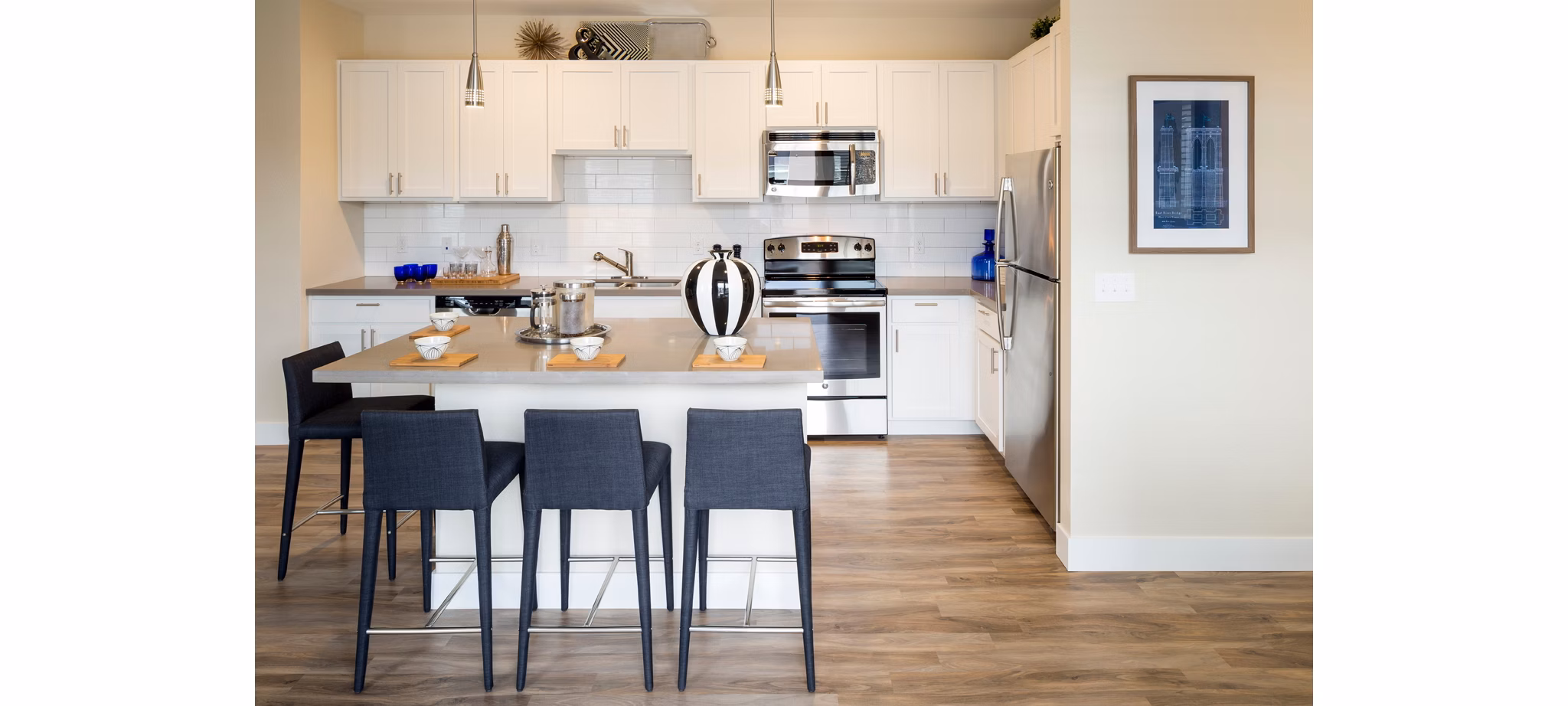 Modern kitchen with stainless steel appliances at Pearl DTC Apartments, offering luxury living in a premier location