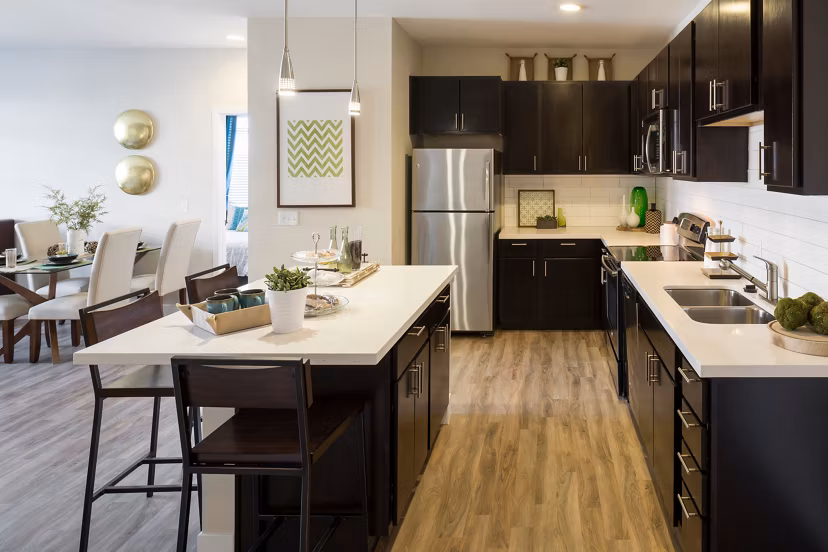 Modern kitchen with stainless steel appliances at Pearl DTC Apartments