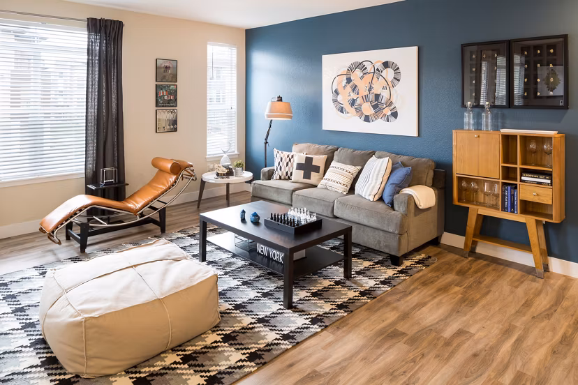 Cozy living room with modern decor and abundant natural light at Pearl DTC Apartments in Denver