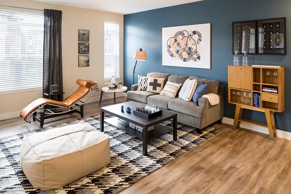 Cozy living room with modern decor and abundant natural light at Pearl DTC Apartments in Denver