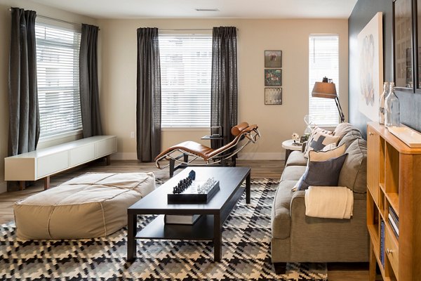 Modern living room with a sleek design and abundant natural light at Pearl DTC Apartments in Denver