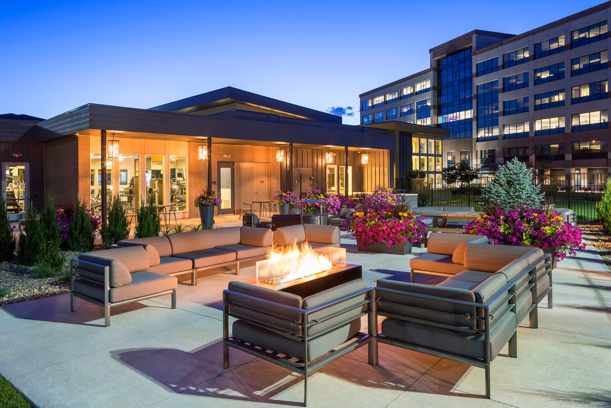 Fire pit with cozy seating at Pearl DTC Apartments' outdoor lounge area