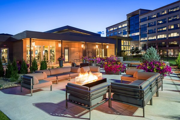 Fire pit with cozy seating at Pearl DTC Apartments' outdoor lounge area