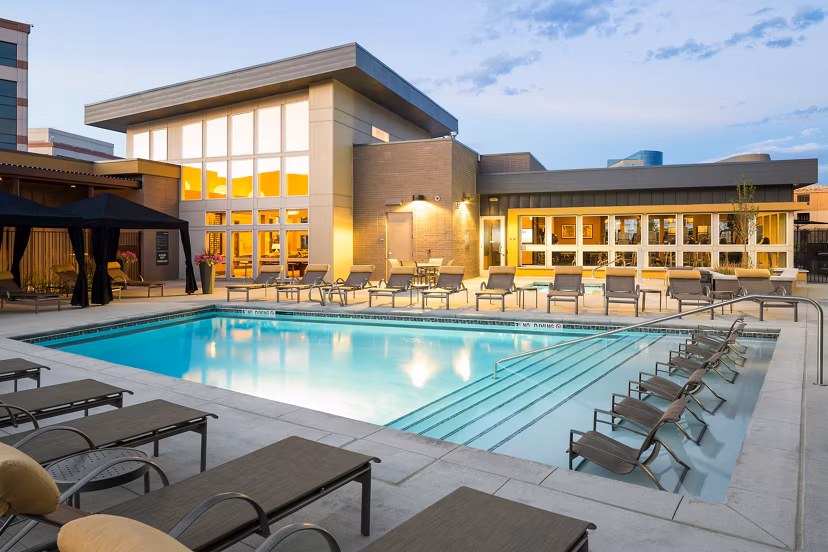 Elegant pool area with lounge seating at Pearl DTC Apartments in Denver, a Greystar luxury property