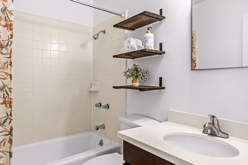 Modern bathroom with dual sinks and sleek fixtures at Kapilina Beach Homes Apartments, offering luxury living in a serene beachside setting