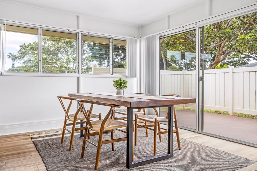 Dining room featuring sleek furniture and coastal decor at Kapilina Beach Homes Apartments