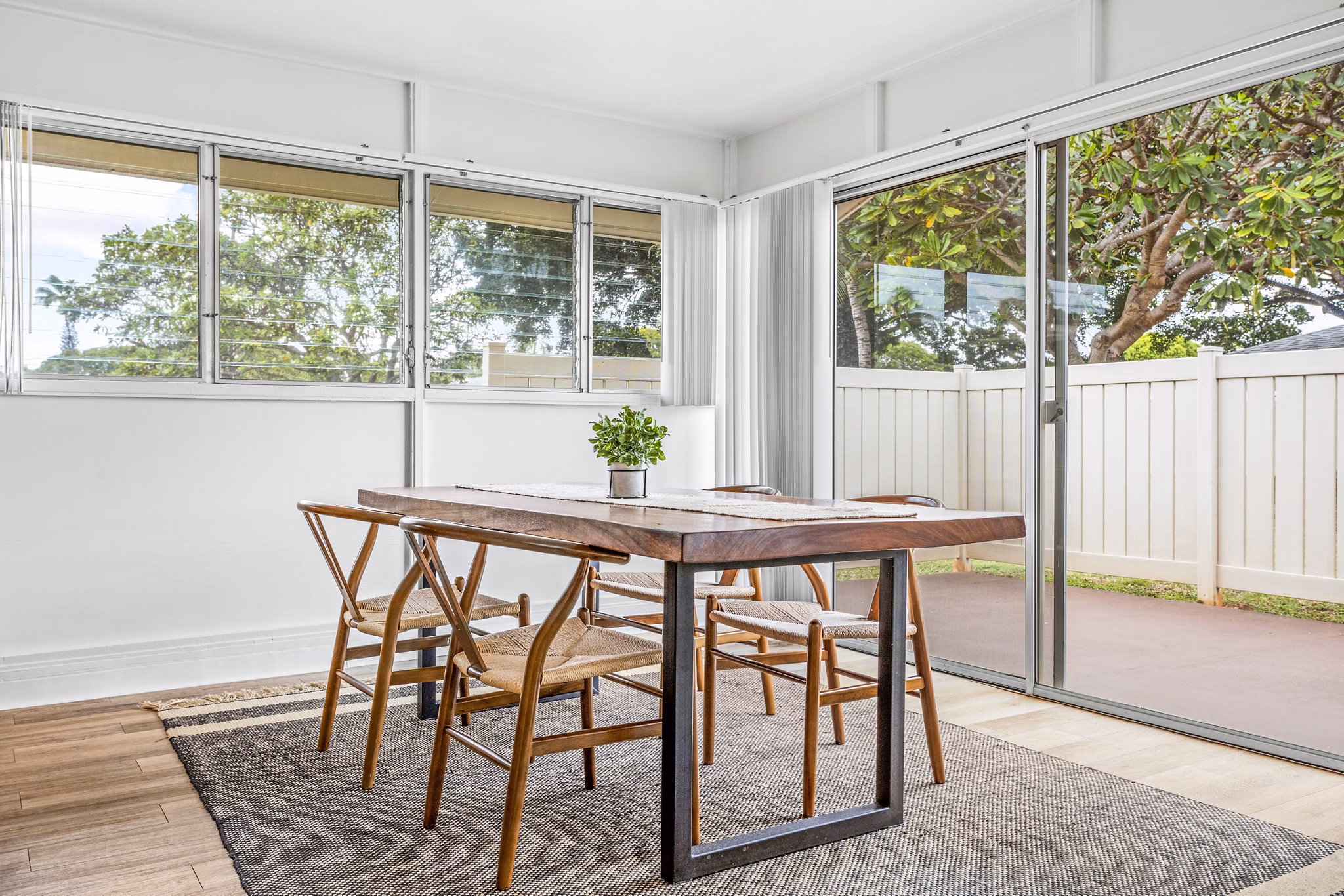 Dining room featuring sleek furniture and coastal decor at Kapilina Beach Homes Apartments