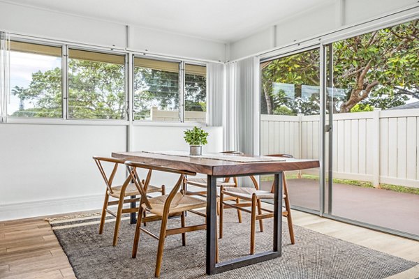 Dining room featuring sleek furniture and coastal decor at Kapilina Beach Homes Apartments