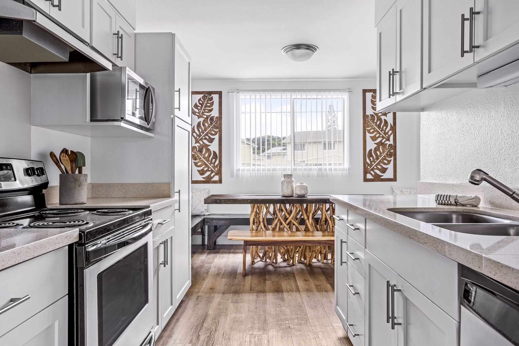 Modern kitchen with stainless steel appliances at Kapilina Beach Homes Apartments
