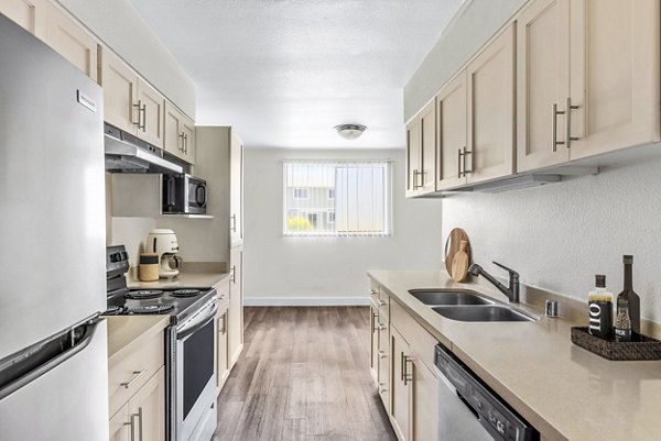 Modern kitchen with stainless steel appliances at Kapilina Beach Homes Apartments in Hawaii