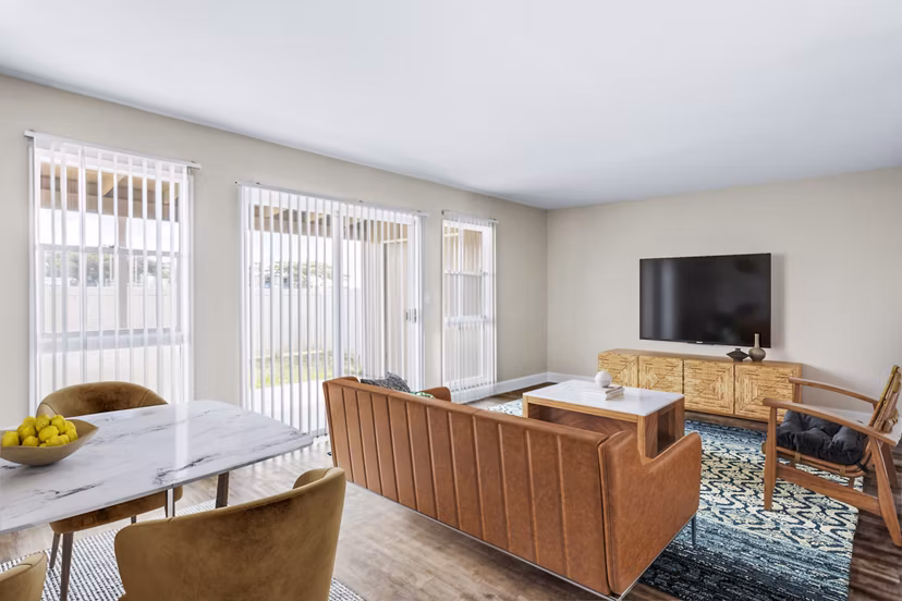 Spacious living room with beach-inspired decor in Kapilina Beach Homes Apartments