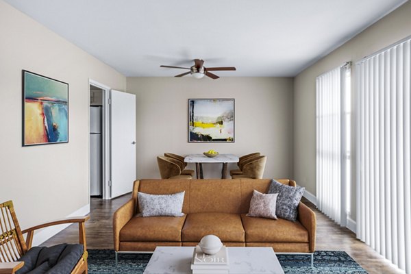 Spacious living room with cozy seating and ocean views in Kapilina Beach Homes Apartments