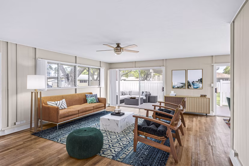 Open living room at Kapilina Beach Homes with cozy seating and ocean views, perfect for relaxation and entertainment