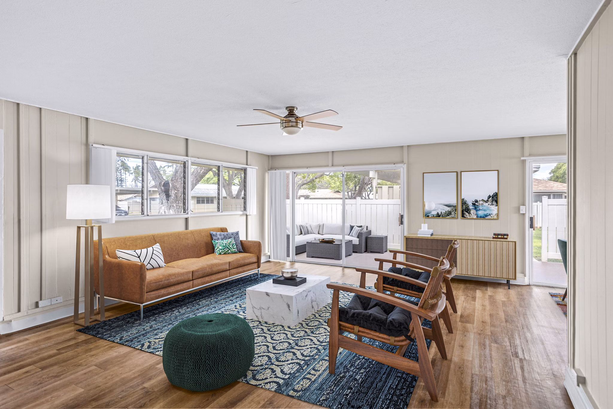 Open living room at Kapilina Beach Homes with cozy seating and ocean views, perfect for relaxation and entertainment
