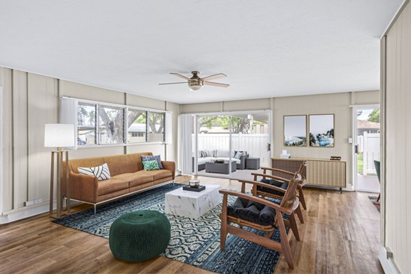 Open living room at Kapilina Beach Homes with cozy seating and ocean views, perfect for relaxation and entertainment