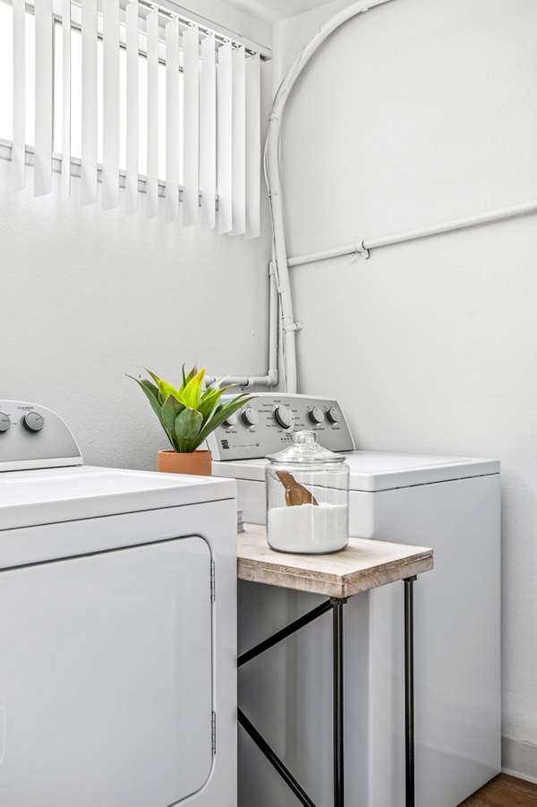 Laundry room with state-of-the-art washers and dryers at Kapilina Beach Homes Apartments near the scenic beaches of Oahu