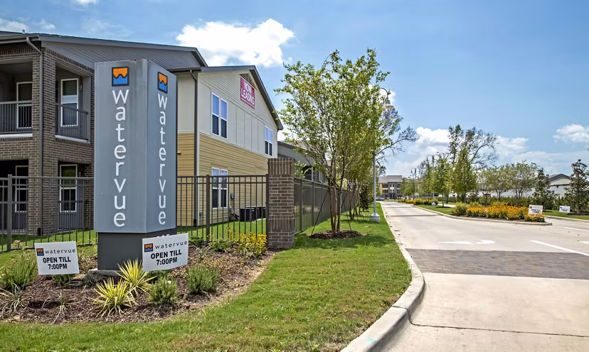 Watervue Apartments: Scenic view of luxury riverside apartments in vibrant community