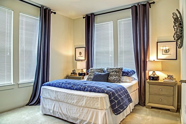 Watervue Apartments: Cozy bedroom with elegant design and natural light