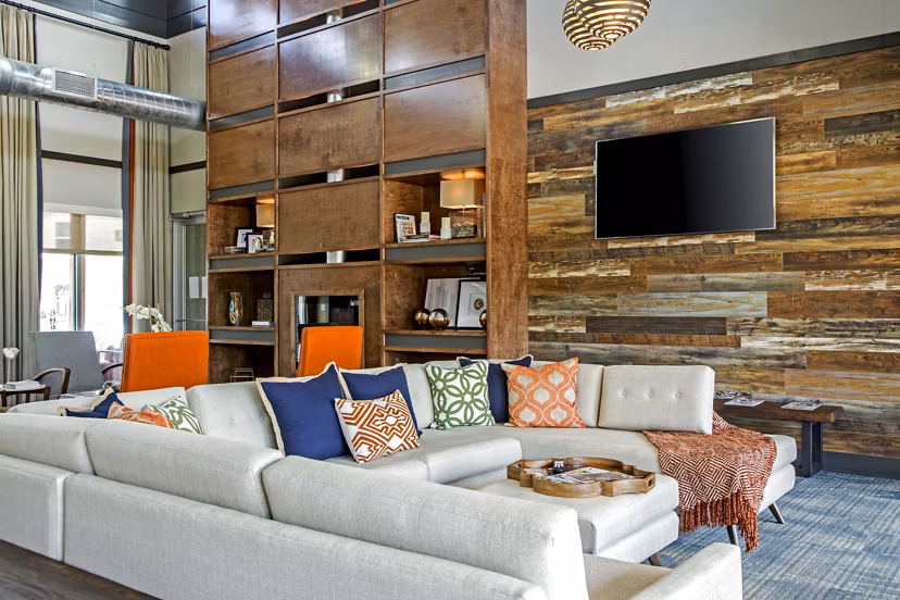 Upscale clubhouse featuring modern seating and game area at Watervue Apartments