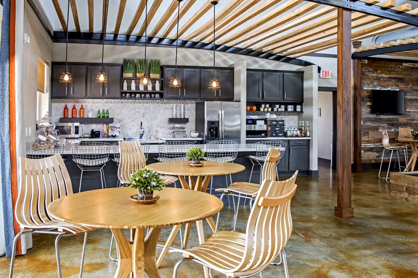 Clubhouse featuring modern design and entertainment spaces at Watervue Apartments, ideal for social gatherings and relaxation