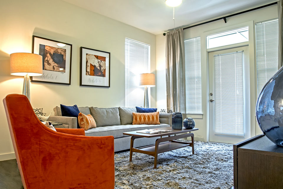 Spacious living room with modern decor in Watervue Apartments
