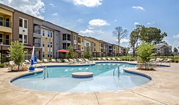Riverside pool at Watervue Apartments offering tranquil views and luxury leisure spaces