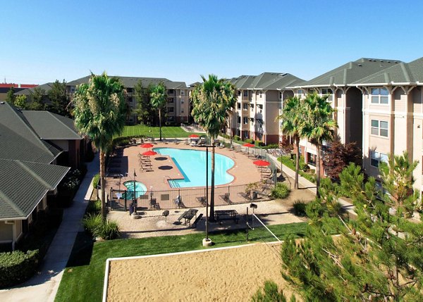 Contemporary outdoor pool at The U Apartments offering luxury relaxation