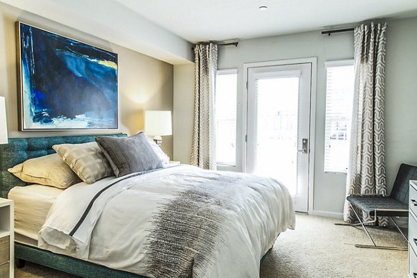 Modern bedroom featuring elegant decor at Dylan Point Loma Apartments Luxury space with stylish furnishings and ambient lighting for comfort
