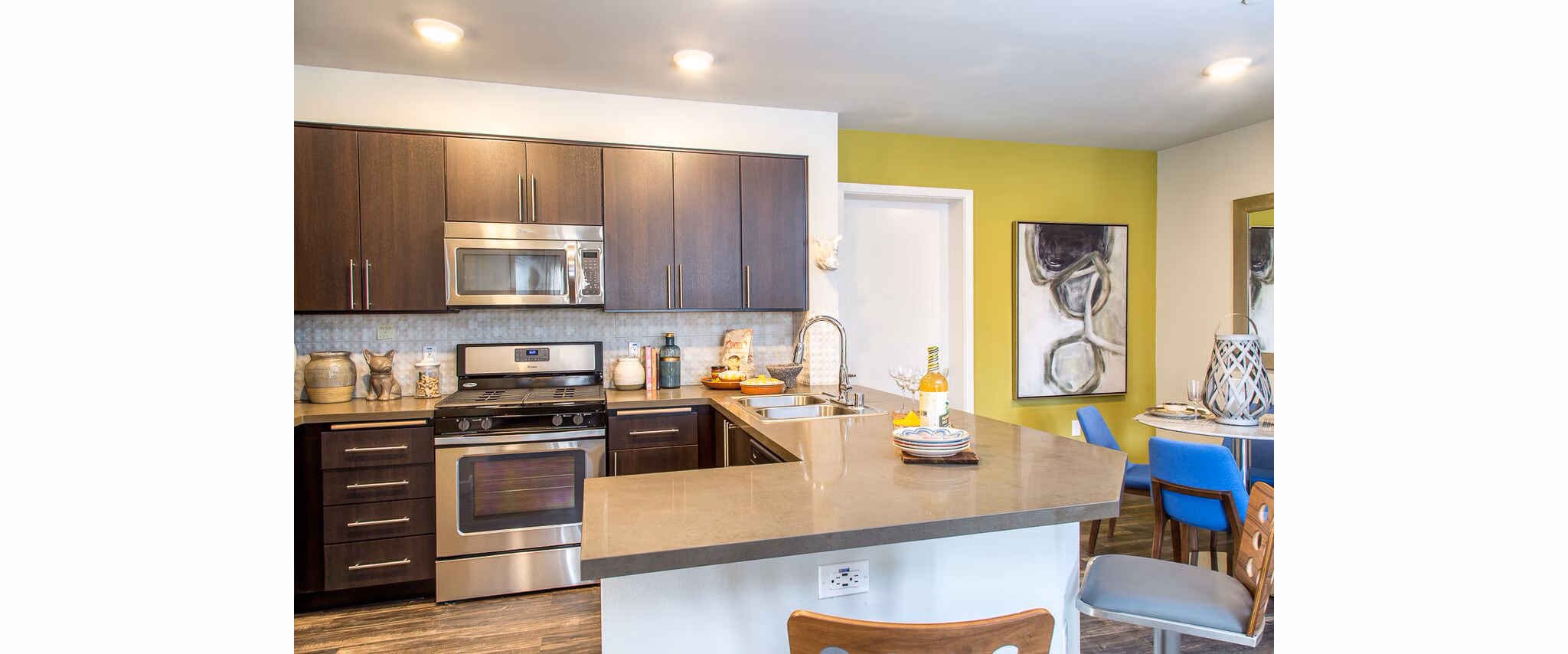 Modern kitchen with stainless steel appliances at Dylan Point Loma Apartments