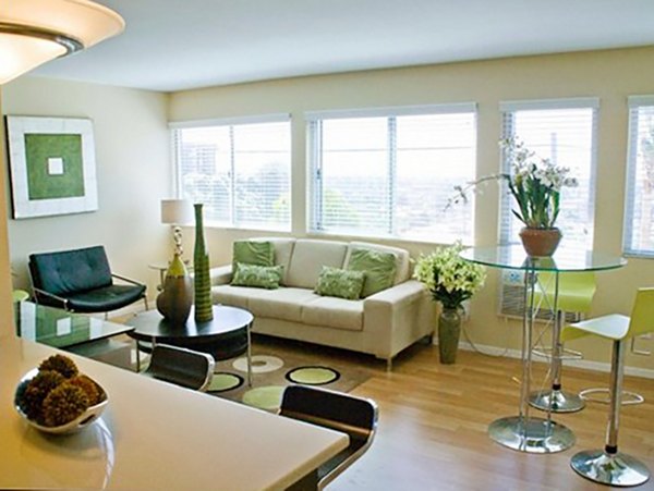 Living room with modern decor and large windows at Dylan Point Loma Apartments