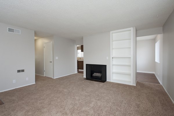 Woodside Park Apartments: Modern living room with stylish furniture and large windows in a luxury apartment setting