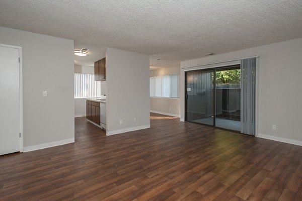 Spacious living room with modern decor at Woodside Park Apartments